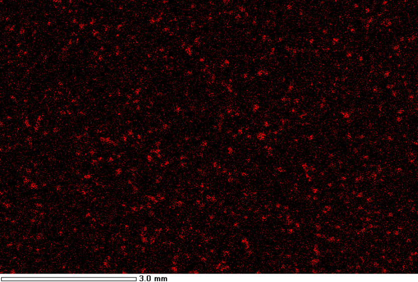 Mikroskopisches Bild des Kunststoffgranulats (schwarzer Hintergrund) mit gleichmäßigen roten Punkten (Zeolith)
